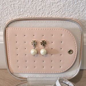 Tory Burch T logo pearl earrings.